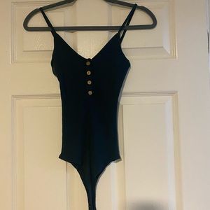 Green thong body suit